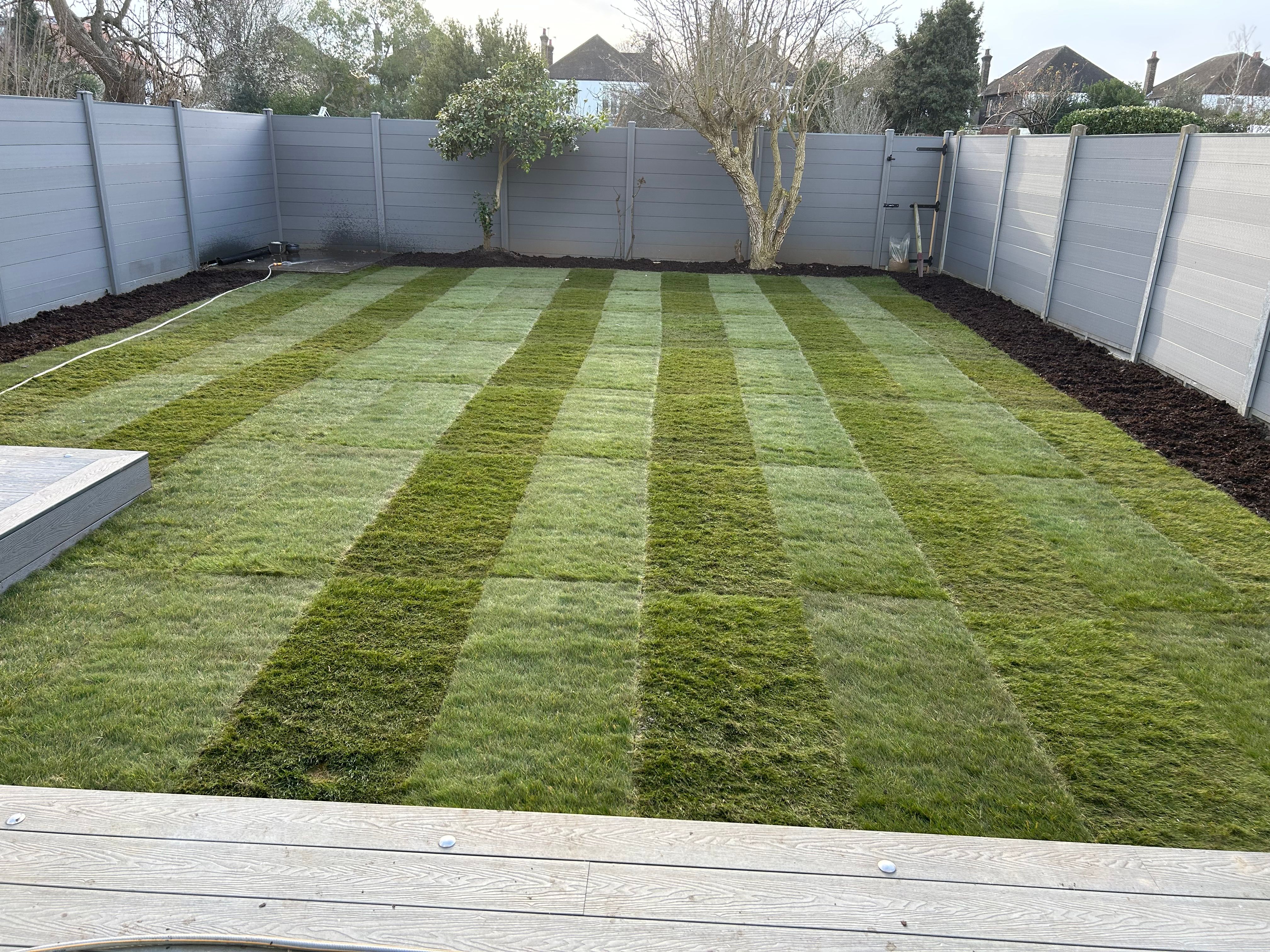 Beautiful landscaped garden with professional lawn maintenance